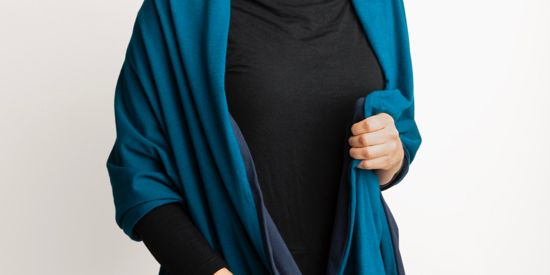 Woman wearing Everyday Sabbatical oversized pashmina — lightweight travel wrap.