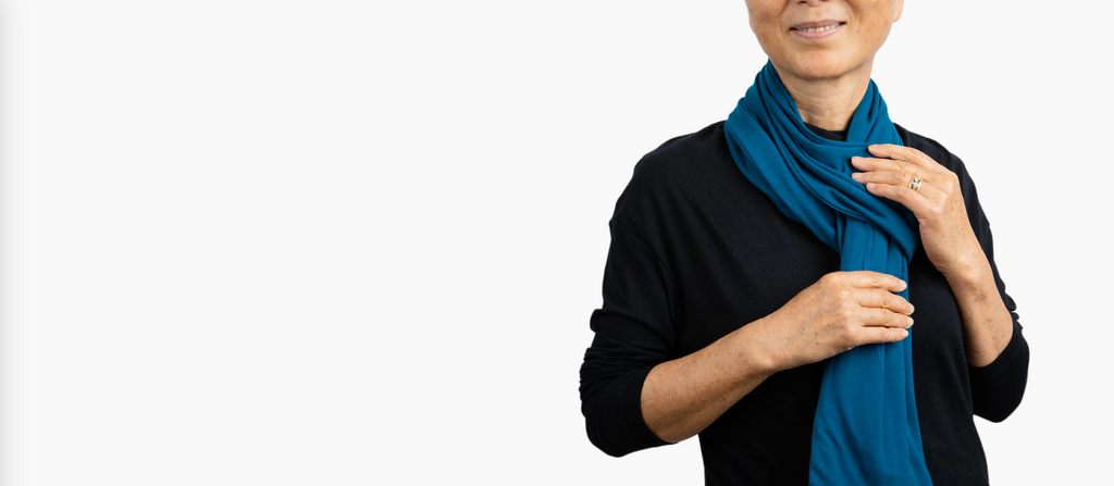 Woman wearing Everyday Sabbatical oversized pashmina — lightweight travel wrap.