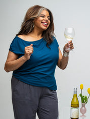 Everyday Sabbatical off-shoulder top — soft, wrinkle-resistant, flattering neckline.